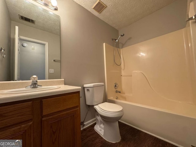 1048 Brandon Ln, Stone Mountain, GA 30083 - bathroom with vanity, a textured ceiling, toilet, and visible vents
