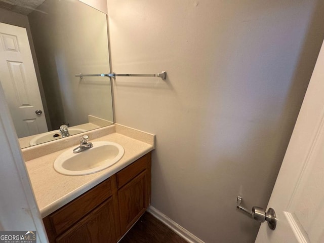 1048 Brandon Ln, Stone Mountain, GA 30083 - bathroom featuring baseboards and vanity