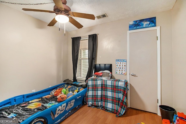 7845 Chase Woods Dr, Jonesboro, GA 30236 - bedroom with wood finished floors and a ceiling fan