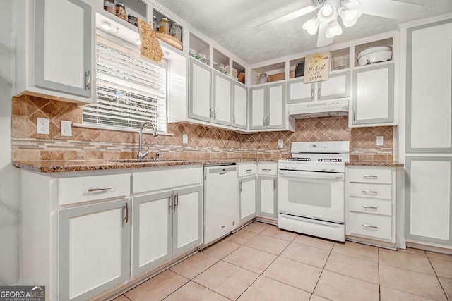 7845 Chase Woods Dr, Jonesboro, GA 30236 - kitchen with white appliances, under cabinet range hood, ceiling fan, light tile patterned floors, and a textured ceiling