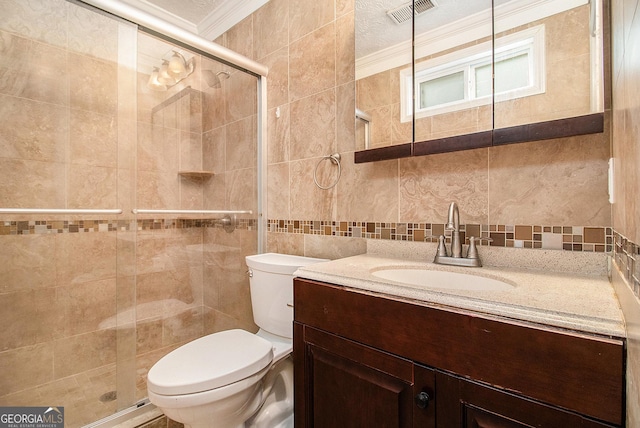 7845 Chase Woods Dr, Jonesboro, GA 30236 - full bath featuring tile walls, vanity, toilet, crown molding, and a stall shower