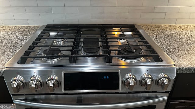 106 Jake Colton Dr, Kingsland, GA 31548 - interior details featuring stainless steel gas range oven and tasteful backsplash