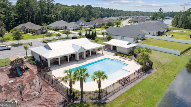 106 Jake Colton Dr, Kingsland, GA 31548 - view of swimming pool with fence, a patio area, a residential view, a fenced in pool, and a lawn