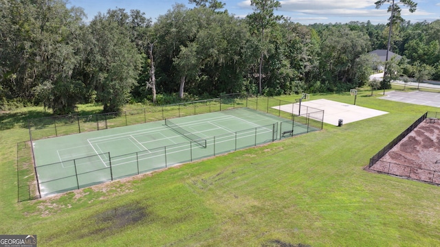 106 Jake Colton Dr, Kingsland, GA 31548 - view of tennis court featuring a yard and fence