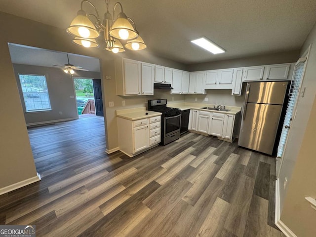 kitchen with white cabinetry, light countertops, appliances with stainless steel finishes, and under cabinet range hood