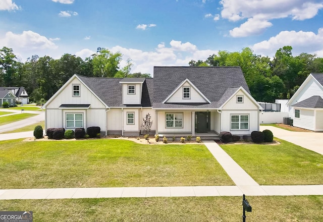 216 Morningside Dr, Thomasville, GA 31792 - modern farmhouse style home featuring a porch, roof with shingles, a front yard, board and batten siding, and central AC unit