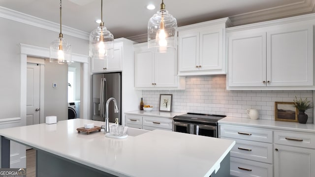 216 Morningside Dr, Thomasville, GA 31792 - kitchen with washer / dryer, light countertops, appliances with stainless steel finishes, and a sink