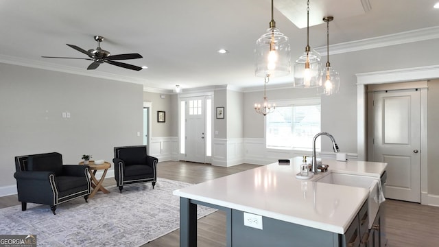 216 Morningside Dr, Thomasville, GA 31792 - kitchen featuring ornamental molding, light countertops, and wood finished floors
