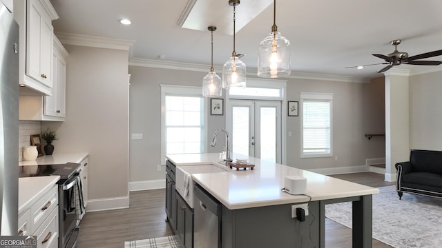 216 Morningside Dr, Thomasville, GA 31792 - kitchen featuring dishwasher, light countertops, electric range oven, and a sink