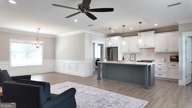 216 Morningside Dr, Thomasville, GA 31792 - kitchen with light wood finished floors, open floor plan, stainless steel refrigerator with ice dispenser, white cabinets, and visible vents
