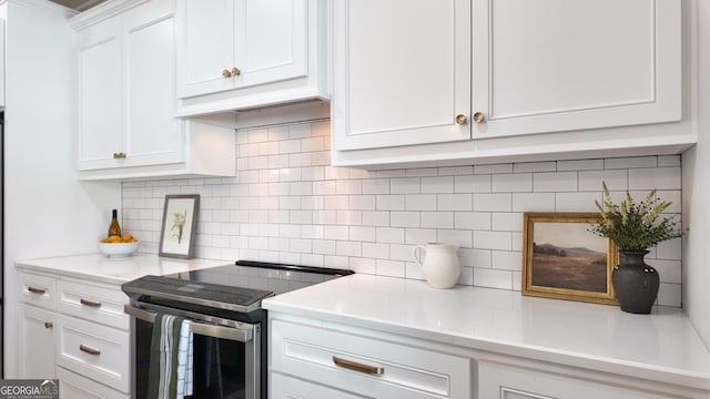 216 Morningside Dr, Thomasville, GA 31792 - kitchen with white cabinetry, light countertops, and stainless steel range with electric cooktop