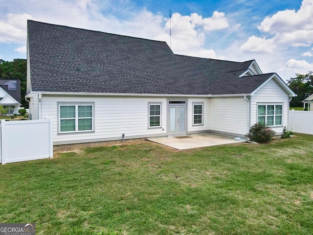 216 Morningside Dr, Thomasville, GA 31792 - back of house featuring a yard, roof with shingles, fence, and a patio
