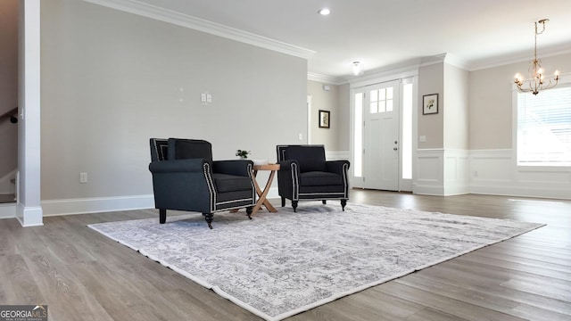 216 Morningside Dr, Thomasville, GA 31792 - sitting room featuring an inviting chandelier, ornamental molding, and wood finished floors