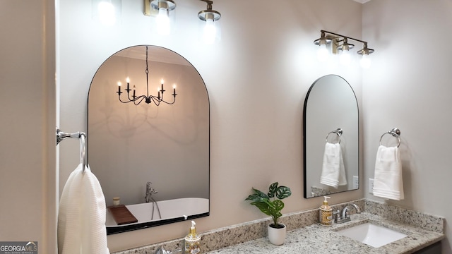 216 Morningside Dr, Thomasville, GA 31792 - bathroom featuring a chandelier and vanity