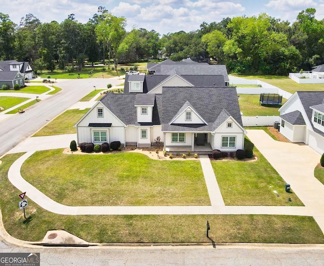 216 Morningside Dr, Thomasville, GA 31792 - view of front facade featuring fence, a shingled roof, and a front yard
