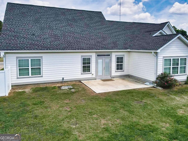 216 Morningside Dr, Thomasville, GA 31792 - rear view of house with a shingled roof, a patio area, and a lawn