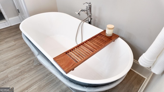 216 Morningside Dr, Thomasville, GA 31792 - details featuring a soaking tub and wood finished floors