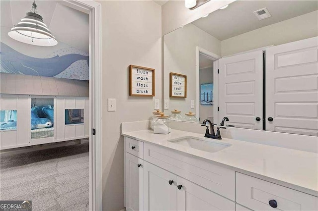bathroom featuring vanity and visible vents