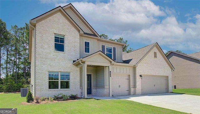 view of front of property with board and batten siding, driveway, brick siding, a garage, and a front yard