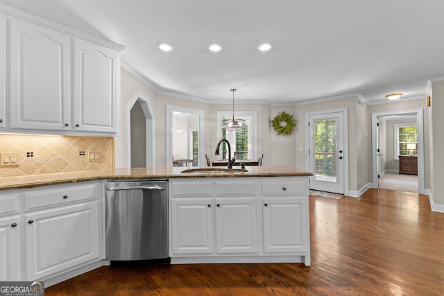 kitchen featuring stainless steel dishwasher, a sink, white cabinetry, crown molding, and decorative backsplash