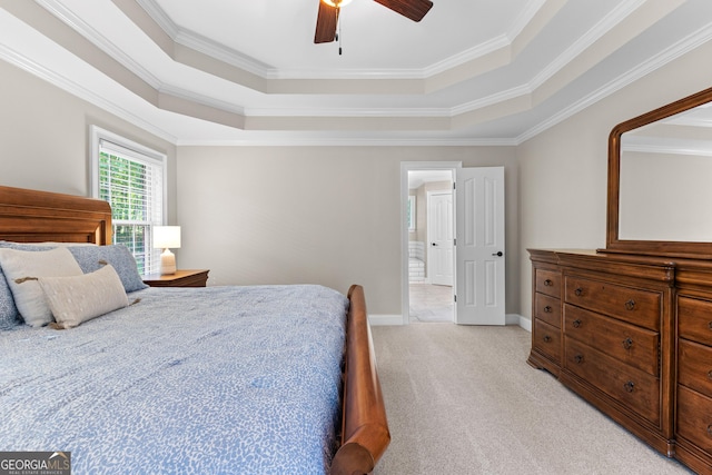 bedroom featuring a ceiling fan, a raised ceiling, ornamental molding, and light colored carpet