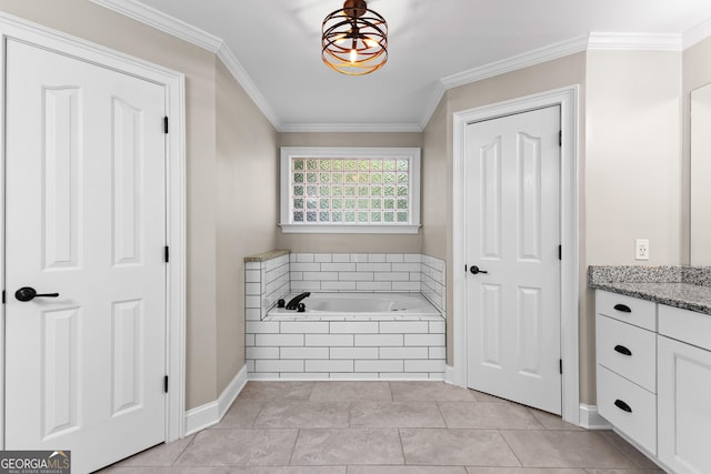 bathroom featuring a bath, crown molding, baseboards, tile patterned flooring, and vanity