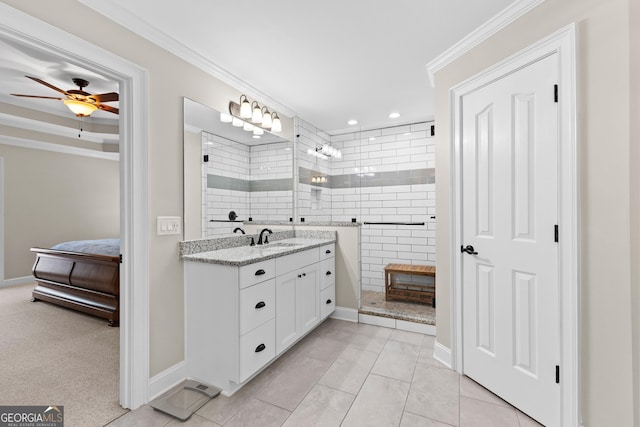 bathroom featuring a ceiling fan, a walk in shower, ensuite bath, vanity, and ornamental molding