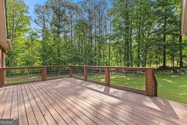 wooden deck with a yard