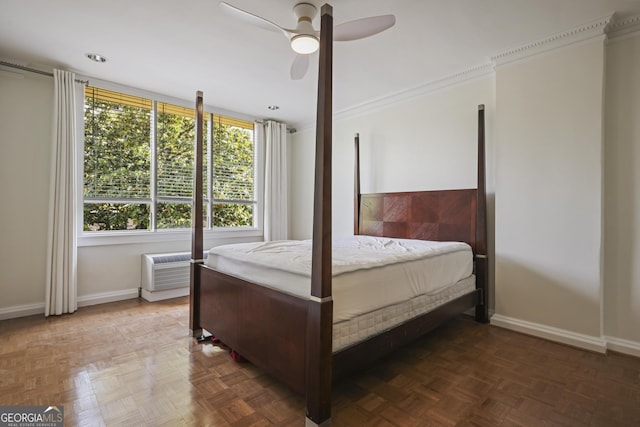 bedroom with baseboards, crown molding, and a ceiling fan