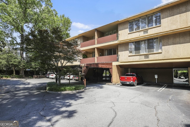 view of property with covered parking