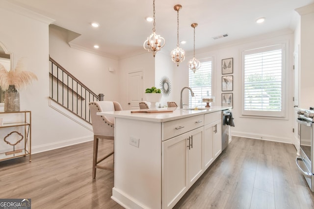 3313 Bartee Walk, Suwanee, GA 30024 - kitchen featuring visible vents, a sink, a kitchen breakfast bar, crown molding, and light countertops
