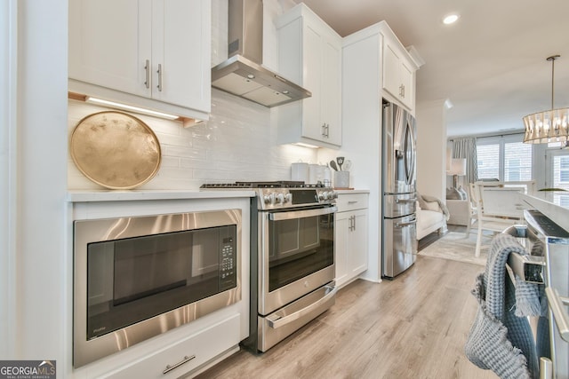3313 Bartee Walk, Suwanee, GA 30024 - kitchen featuring wall chimney exhaust hood, stainless steel appliances, decorative backsplash, white cabinetry, and light wood-style flooring
