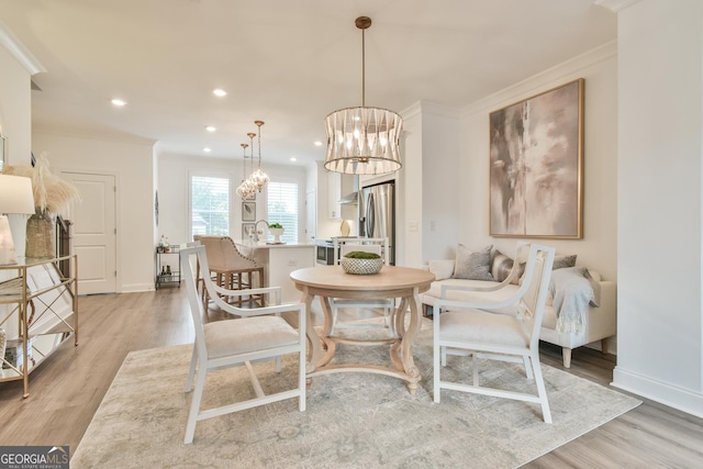 3313 Bartee Walk, Suwanee, GA 30024 - dining room with crown molding, recessed lighting, light wood-type flooring, and an inviting chandelier