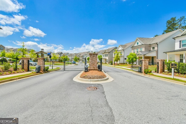 3313 Bartee Walk, Suwanee, GA 30024 - view of road featuring a gate, a residential view, and sidewalks