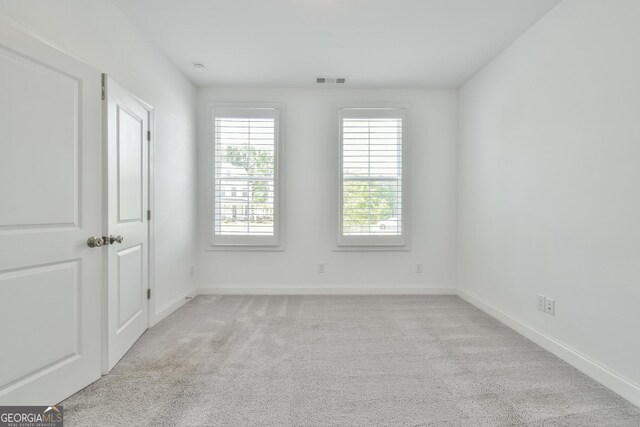 3313 Bartee Walk, Suwanee, GA 30024 - spare room featuring light carpet, baseboards, and visible vents