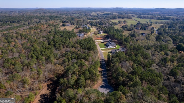 bird's eye view featuring a forest view