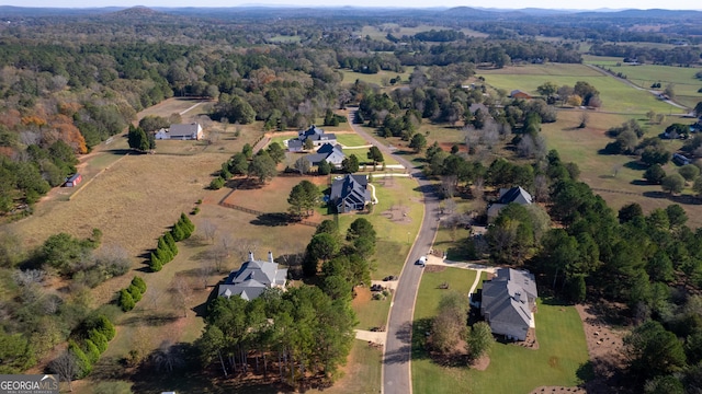 birds eye view of property with a rural view and a forest view