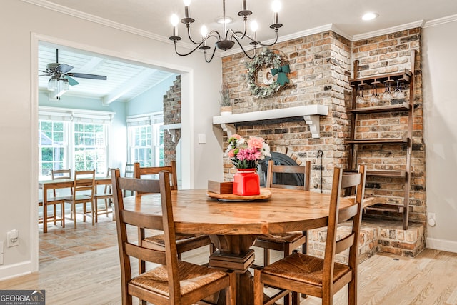 2244 Deer Ridge Dr, Tucker, GA 30087 - dining area with wood finished floors, baseboards, crown molding, a ceiling fan, and a chandelier