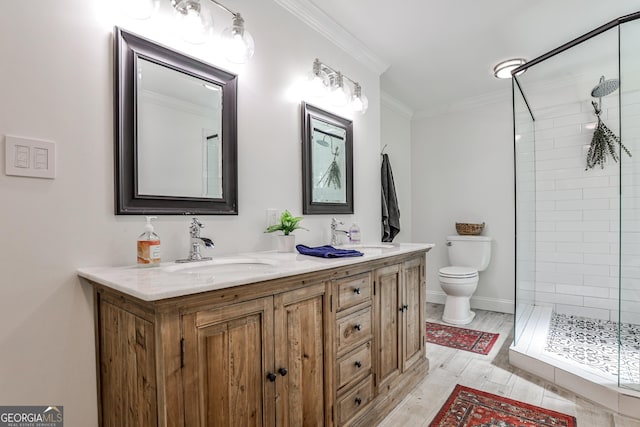 2244 Deer Ridge Dr, Tucker, GA 30087 - full bath featuring toilet, double vanity, a stall shower, ornamental molding, and wood finished floors