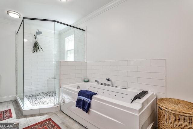 2244 Deer Ridge Dr, Tucker, GA 30087 - full bath with ornamental molding, a stall shower, a jetted tub, and wood finished floors