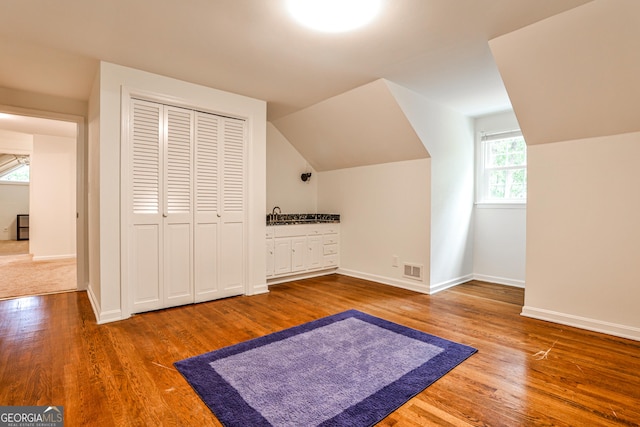 2244 Deer Ridge Dr, Tucker, GA 30087 - bonus room with wood finished floors, vaulted ceiling, and baseboards