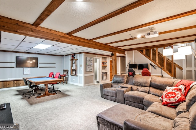 2244 Deer Ridge Dr, Tucker, GA 30087 - carpeted living room featuring beamed ceiling, baseboards, and stairs
