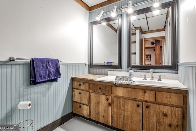 2244 Deer Ridge Dr, Tucker, GA 30087 - bathroom featuring wainscoting and vanity
