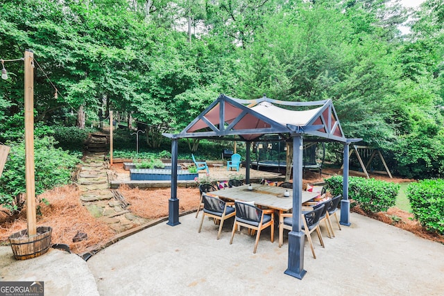 2244 Deer Ridge Dr, Tucker, GA 30087 - view of patio with outdoor dining space and a vegetable garden