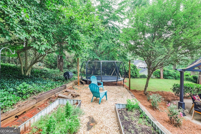 2244 Deer Ridge Dr, Tucker, GA 30087 - view of green lawn featuring a trampoline