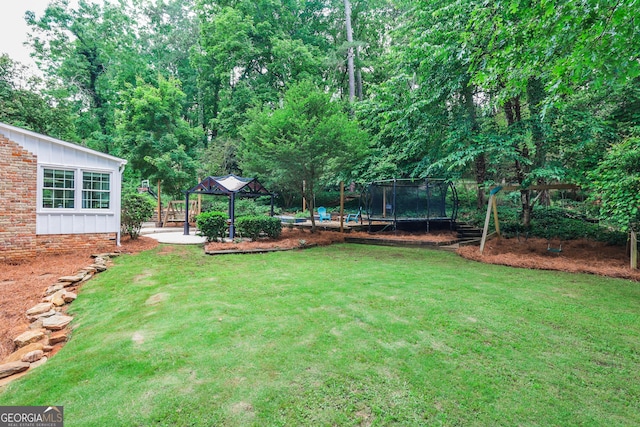 2244 Deer Ridge Dr, Tucker, GA 30087 - view of grassy yard featuring a gazebo and a trampoline
