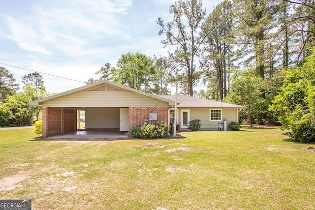 1114 Laurel St, Blackshear, GA 31516 - exterior space featuring a yard, brick siding, and an attached carport