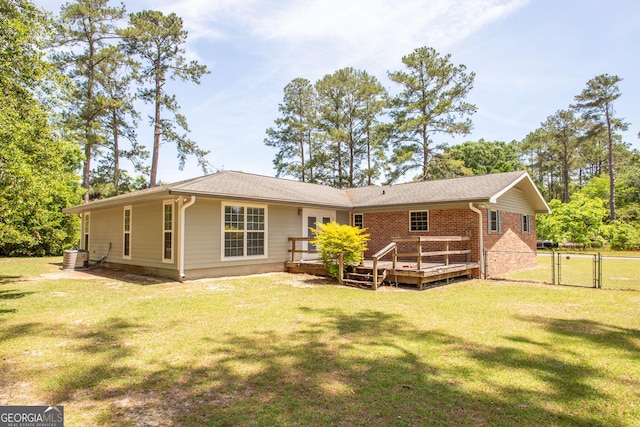 1114 Laurel St, Blackshear, GA 31516 - back of house with a gate, a deck, and a lawn