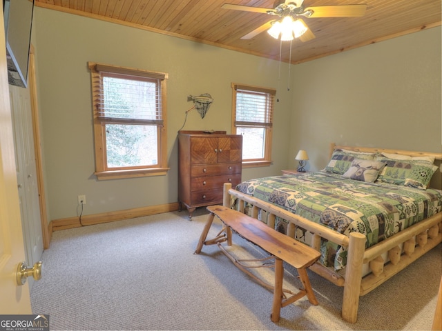 carpeted bedroom featuring wood ceiling, baseboards, and a ceiling fan