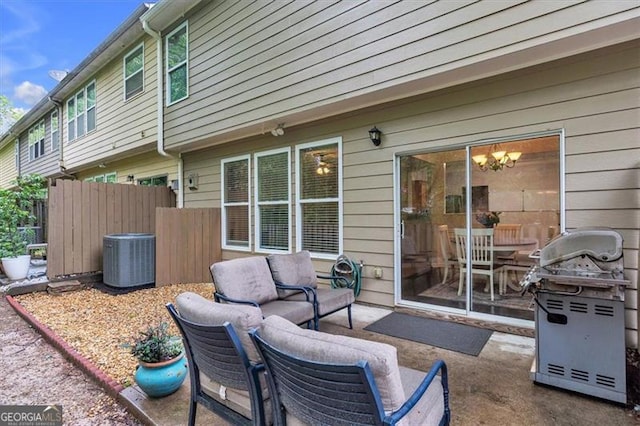 view of patio / terrace featuring cooling unit, area for grilling, fence, and an outdoor living space